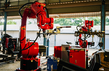 Robotic welding equipment in metal factory plant